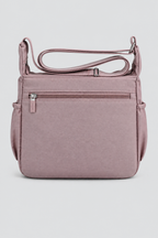 Sac Rosa mauve vu de dos sur fond gris uniforme